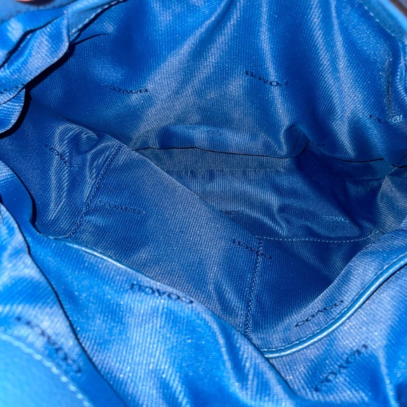 The Coach Edie bag soft slouchy silhouette style with functional design. - Picture 5 of 13